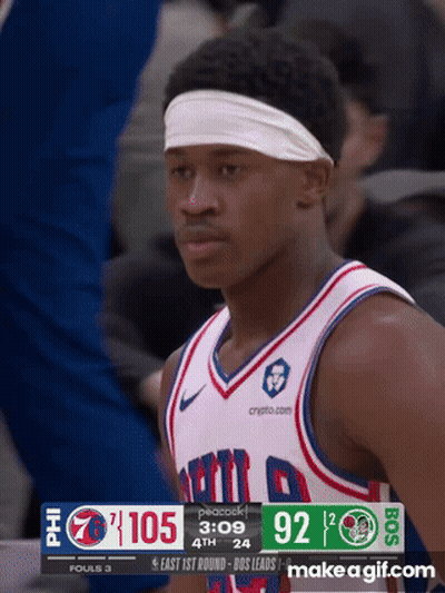 Basketball Player in Headband Looking at Scoreboard