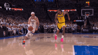 Basketball Player In Indiana Jersey Dribbling GIF