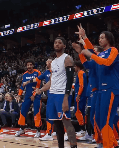 Basketball Player In Knicks Jersey On Court With Teammates GIF