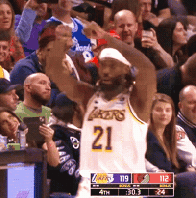 Basketball Player In Lakers Jersey Raising Fist GIF