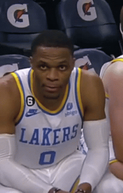 Basketball Player In Lakers Jersey Sitting On Bench GIF