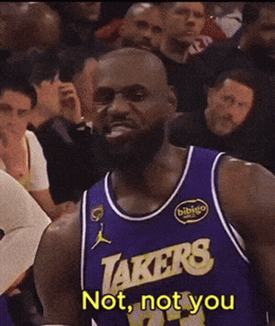 Basketball Player In Lakers Jersey Standing In Front Of Crowd GIF