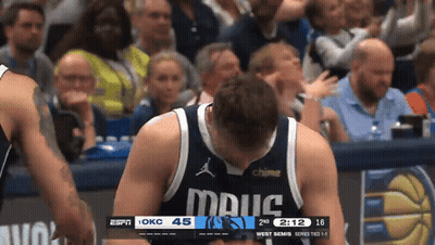 Basketball Player In Mavs Jersey Looking At Scoreboard GIF