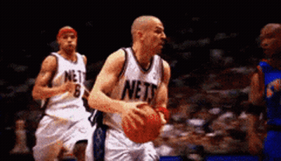 Basketball Player In Nets Jersey Dribbling GIF