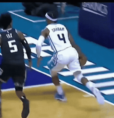 Basketball Player In Number 4 Jersey Dribbling GIF