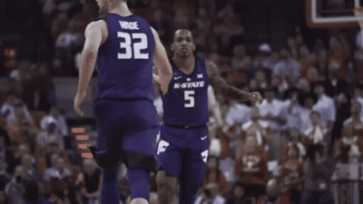 Basketball Player In Number 5 Jersey In Front Of Muscle Milk Sign GIF