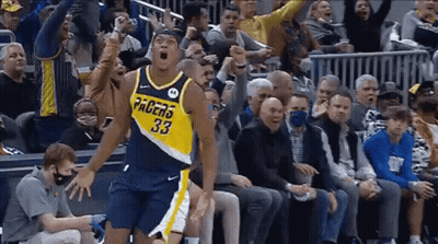 Basketball Player In Pacers Jersey Jumping In Front Of Crowd GIF