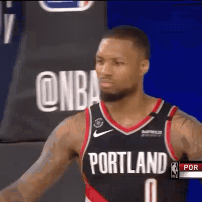 Basketball Player In Portland Jersey In Front Of NBA Logo GIF