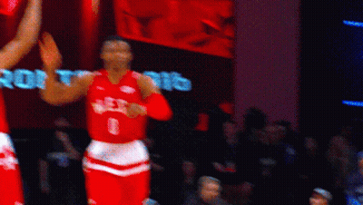 Basketball Player in Red Jersey Saying West