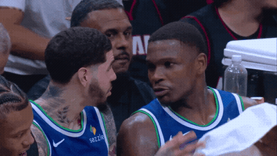 Basketball Player in Sezzle Shirt Talking to Another Player
