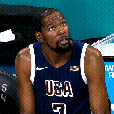 Basketball Player In USA Jersey Sitting On Bench GIF