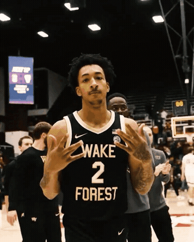 Basketball Player In Wake Forest Jersey On Court GIF