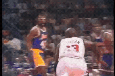Basketball Player In White Jersey 23 Beside Another Player GIF