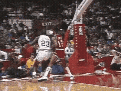 Basketball Player In White Jersey Number 23 Jumping Over Player GIF