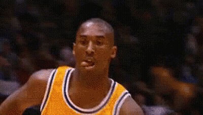 Basketball Player In Yellow Jersey Looking At Camera GIF