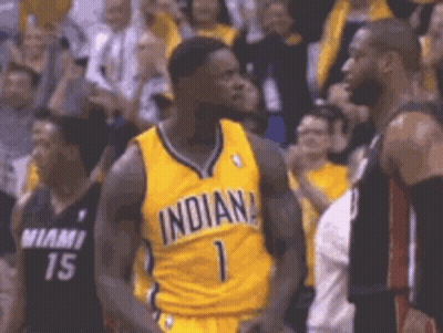 Basketball Player In Yellow Jersey Number 1 Next To Black Player GIF