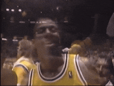 Basketball Player In Yellow Jersey With Letter T GIF