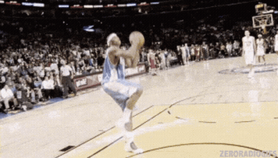 Basketball Player Jumping Holding Basketball GIF