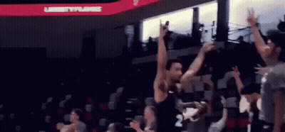 Basketball Player Jumping In Air As Crowd Watches GIF