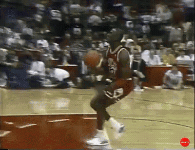 Basketball Player Jumping While Holding Ball GIF