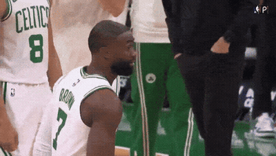 Basketball Player Kneeling In Celtics Jersey GIF