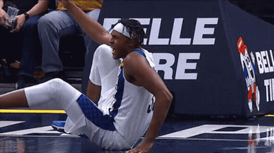 Basketball Player Lying In Front Of Bell Sign GIF