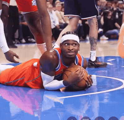 Basketball Player Lying On Floor With Ball GIF