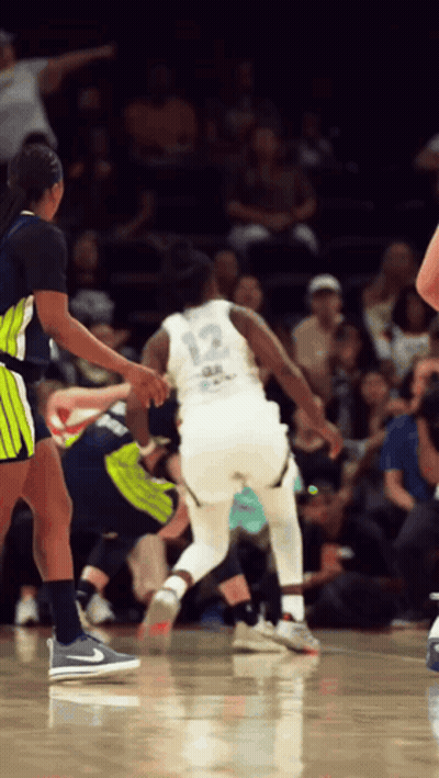 Basketball Player Number 12 Dribbling GIF