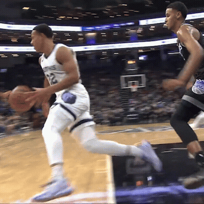 Basketball Player Number 12 Dribbling GIF