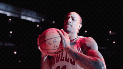 Basketball Player Number 12 Holding Ball GIF