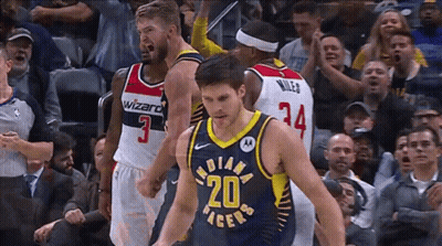 Basketball Player Number 20 Surrounded By Players GIF