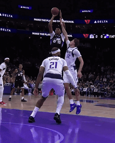 Basketball Player Number 21 Jumping To Catch Ball GIF