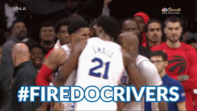 Basketball Player Number 21 Surrounded by Players
