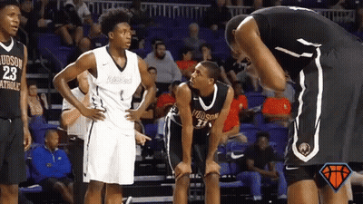 Basketball Player Number 23 Talking To Another Player GIF