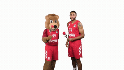 Basketball Player Number 34 Next to Mascot