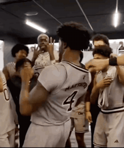 Basketball Player Number 4 Surrounded By Players GIF