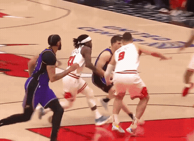 Basketball Player Number 9 Blocking Player Number 21 GIF