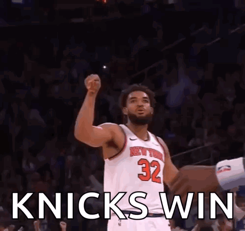 Basketball Player Raising Fist In White Jersey Number 32 GIF