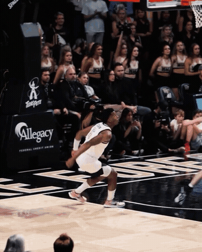 Basketball Player Running In Front Of Allegory Sign GIF