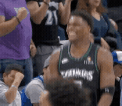 Basketball Player Sitting In Stands Smiling GIF