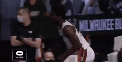 Basketball Player Sitting On Bench With Referee Watching GIF