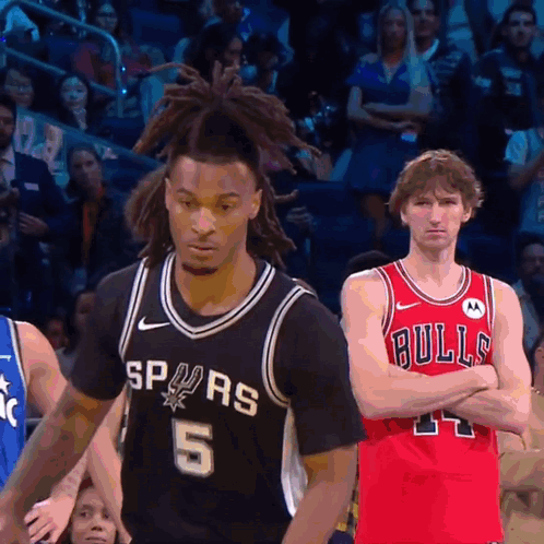 Basketball Player Spurs Jersey Next To Bulls Player GIF