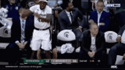 Basketball Player Standing In Stands During Game GIF