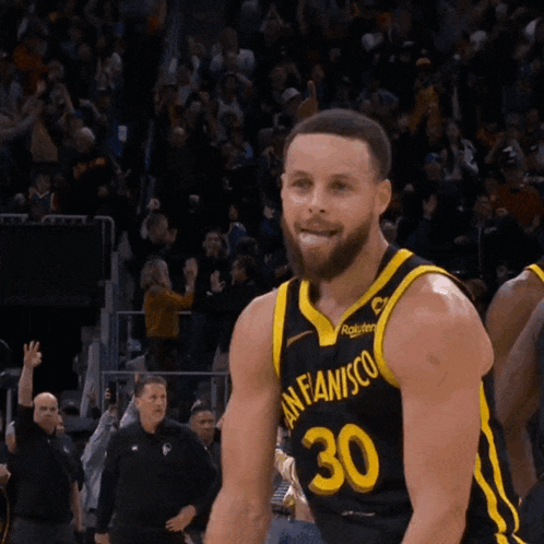 Basketball Player Wearing A Black And Yellow Jersey With The Number 30 On It GIF
