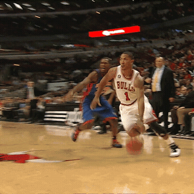 Basketball Player Wearing A Bulls Jersey Dribbles The Ball GIF