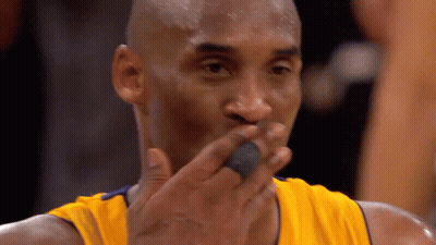 Basketball Player Wearing A Yellow Jersey With A Black Ring On His Finger GIF
