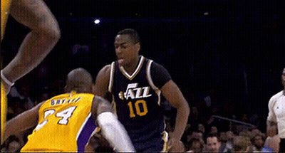 Basketball Player Wearing A Yellow Jersey With The Number 4 GIF