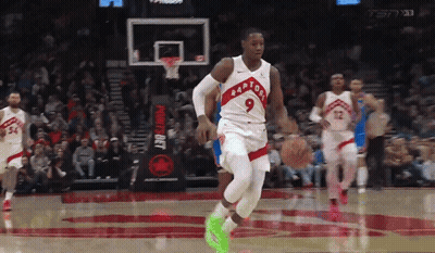 Basketball Player Wearing Number 9 Dribbling GIF