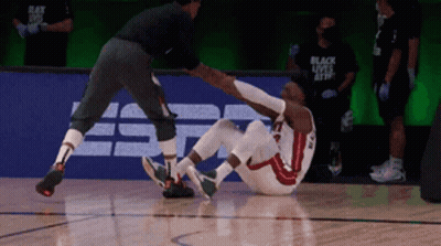 Basketball Player With Knee Injury Helped By Referee GIF
