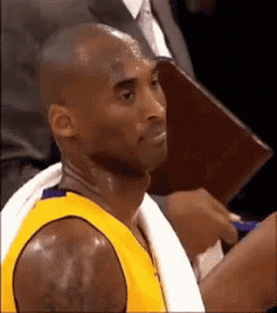 Basketball Player With Towel Around Neck In Stands GIF